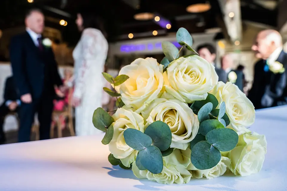 A close up of a wedding bouquet on a table with in Ponti's Italian Kitchen, Fox Valley Sheffield